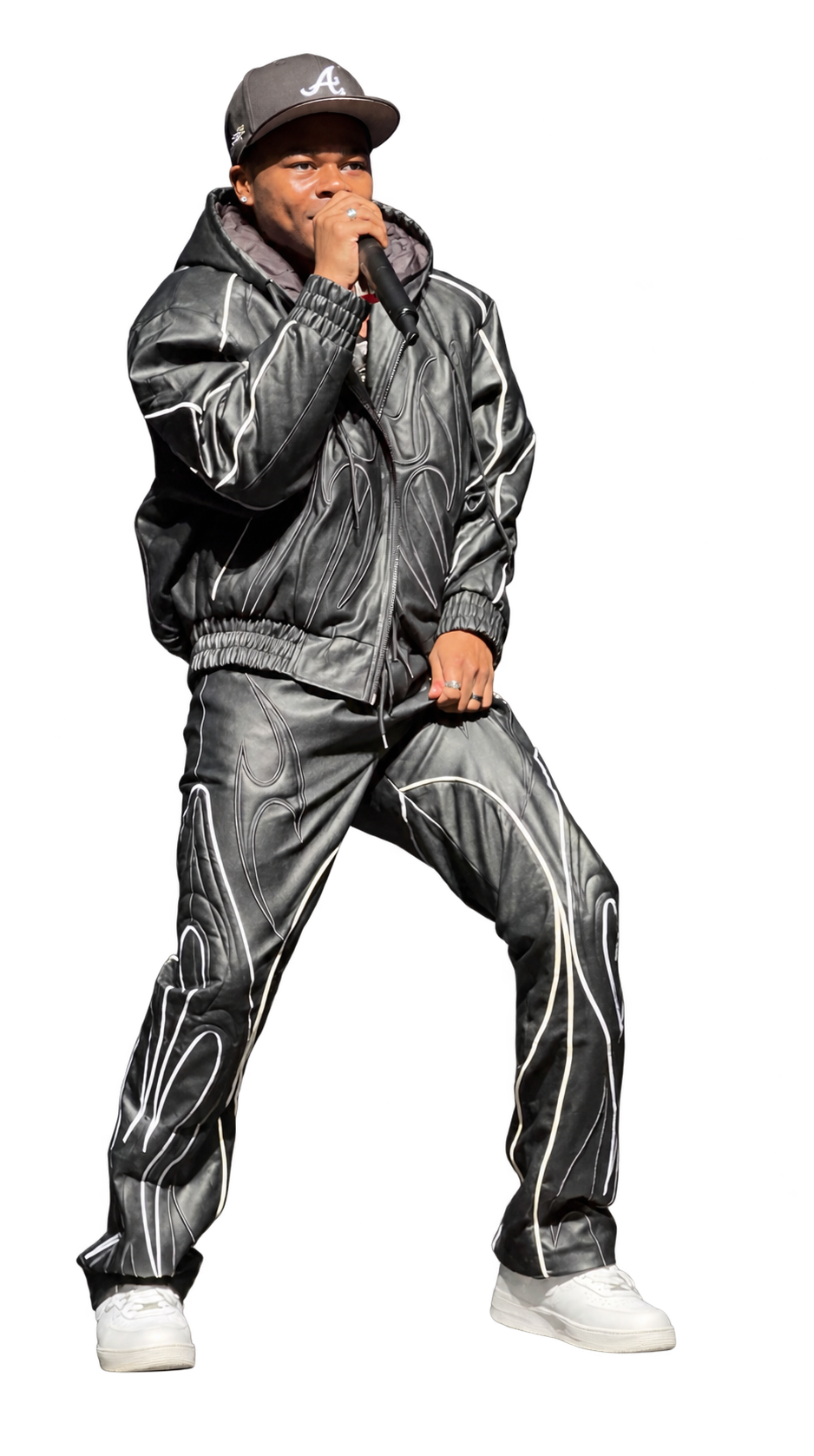RAJA in a black athletic suit performing with a microphone